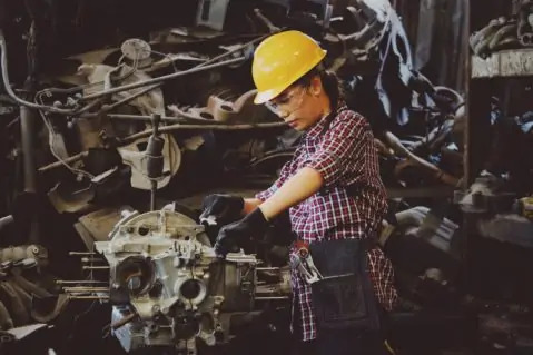 Woman working on machinery