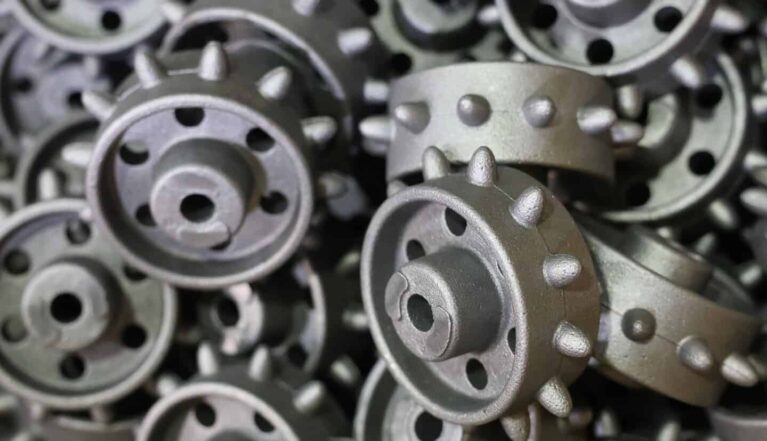 Sand casted parts in a pile